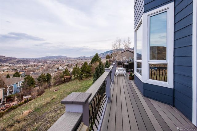 a view of balcony with furniture