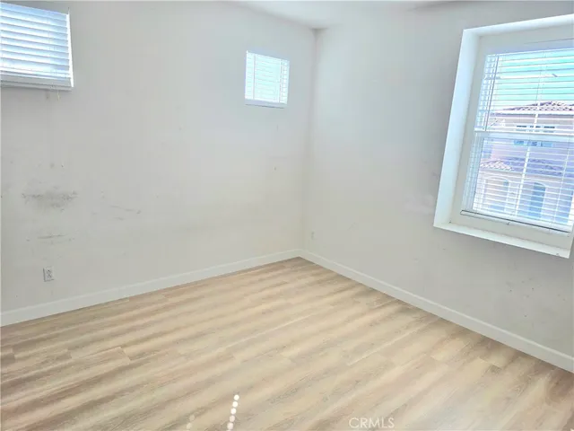 a view of a hallway with windows