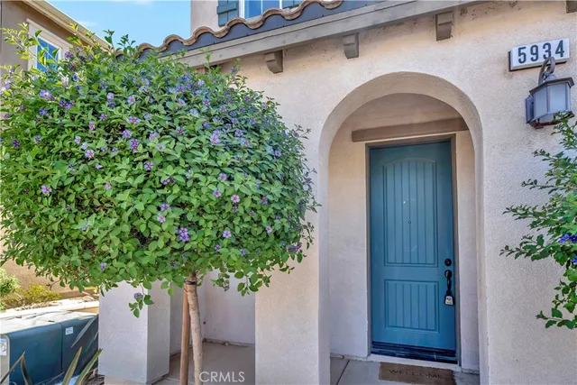 a view of a house with a flower garden