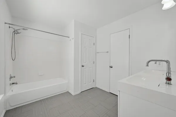 a view of bathroom with dual sinks