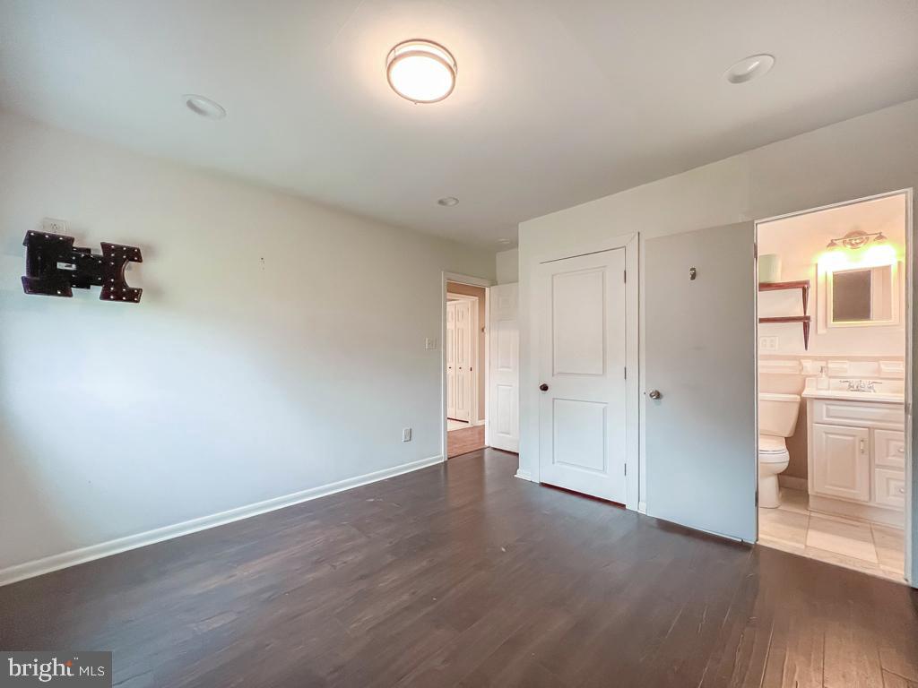 599 Panther Road Warminster, PA 18974 - Photo 23 of 57 an empty room with wooden floor and windows