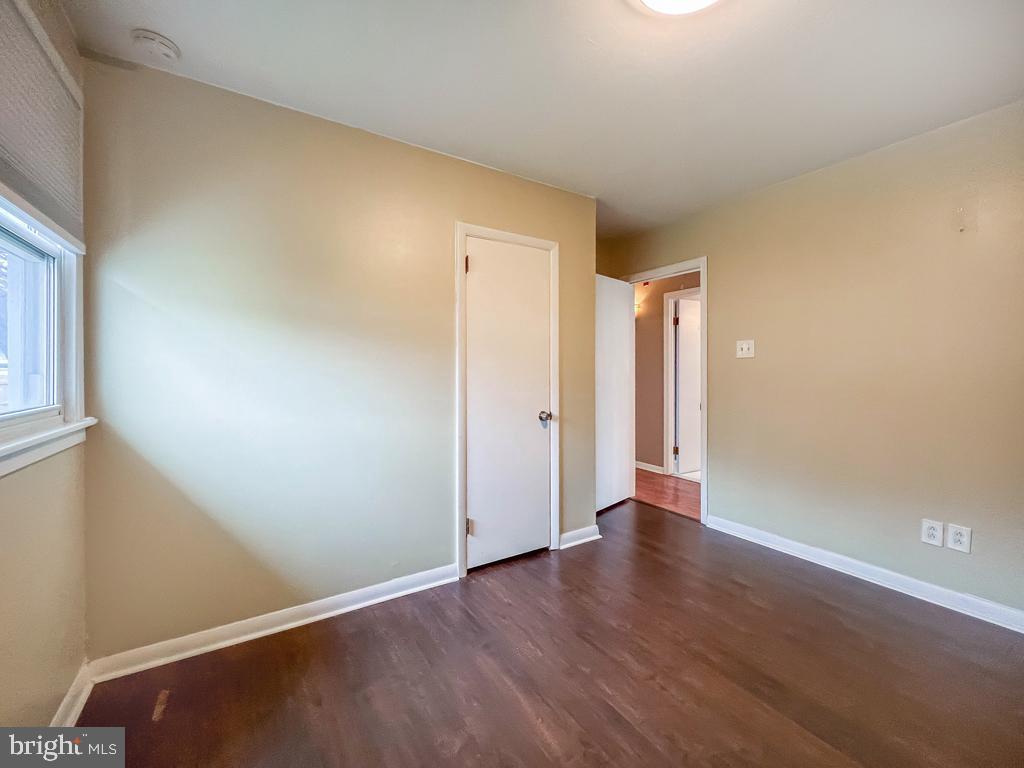 599 Panther Road Warminster, PA 18974 - Photo 30 of 57 an empty room with wooden floor and windows