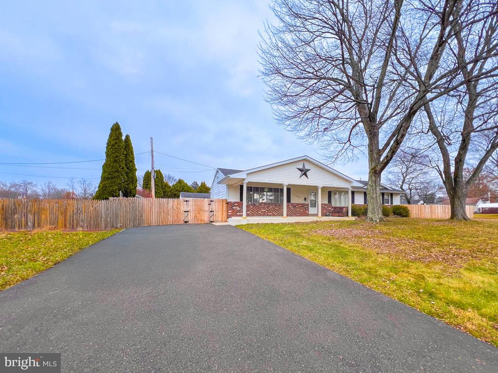 599 Panther Road Warminster, PA 18974 - Photo 3 of 57 a front view of a house with a yard and trees