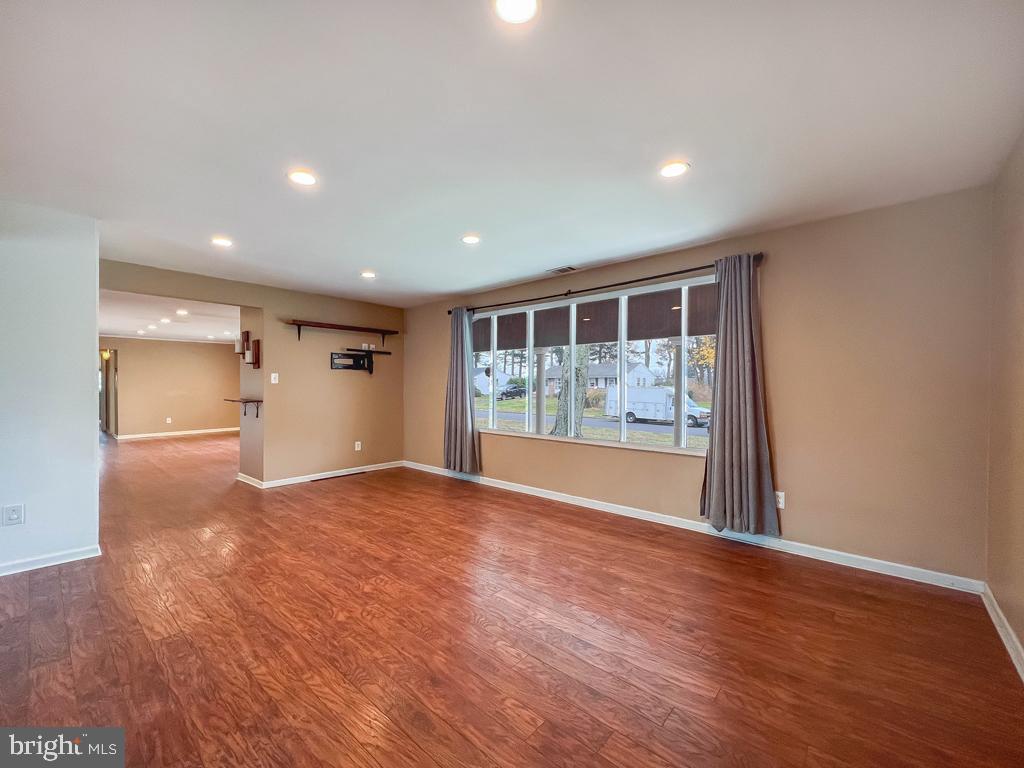 599 Panther Road Warminster, PA 18974 - Photo 33 of 57 a view of an empty room with wooden floor and a window