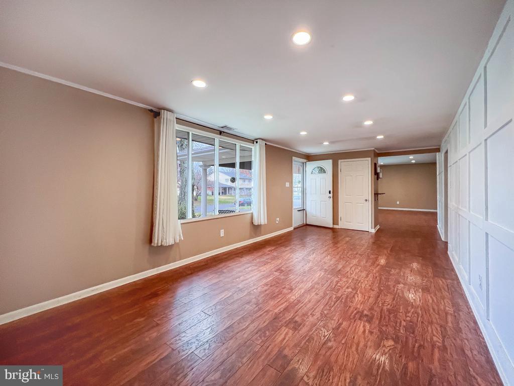 599 Panther Road Warminster, PA 18974 - Photo 8 of 57 a view of an empty room with wooden floor and a window