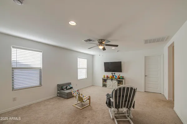 a work room with furniture and a window