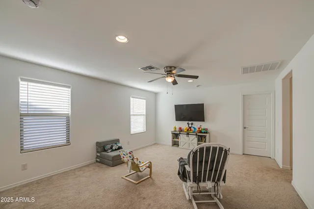 a work room with furniture and a window