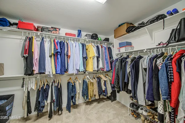 a spacious bathroom with a granite countertop sink mirror and a