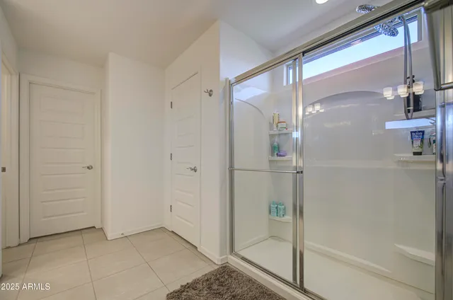 a view of a workspace with furniture and a bookshelf