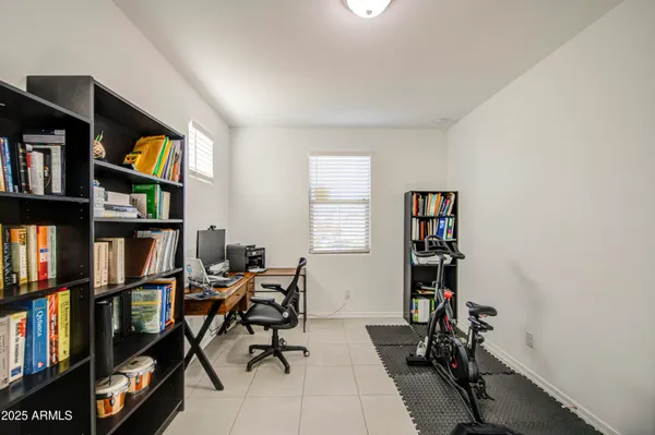 a view of work space with furniture and a window
