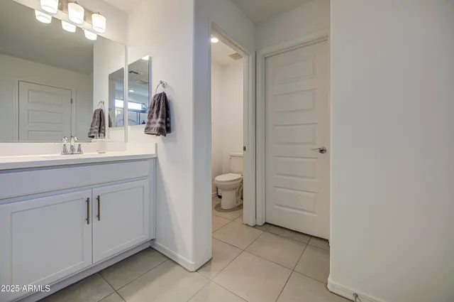 a view of work space with furniture and a window