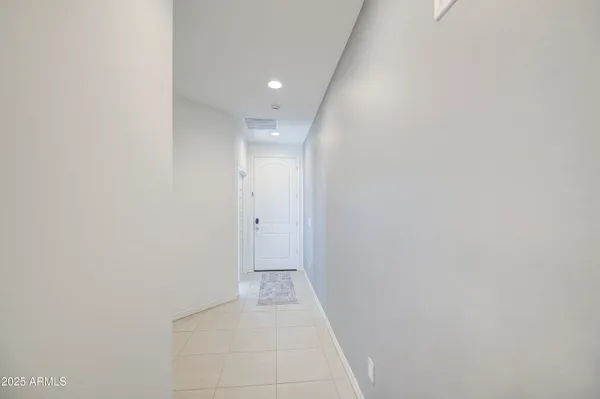 a kitchen with a sink a center island stainless steel appliances and cabinets