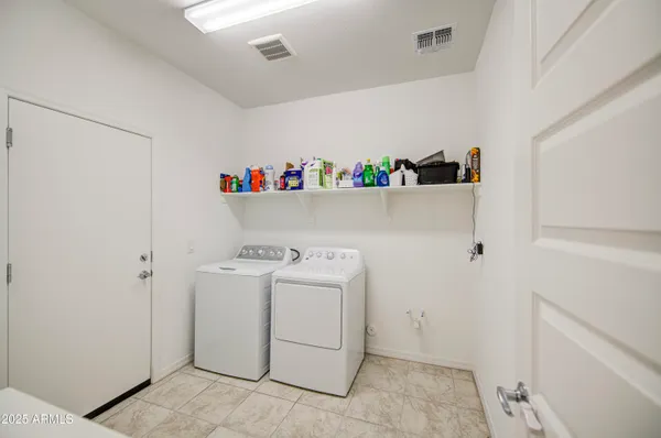a view of a house with backyard porch and sitting area