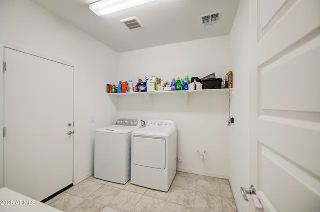 a view of a house with backyard porch and sitting area
