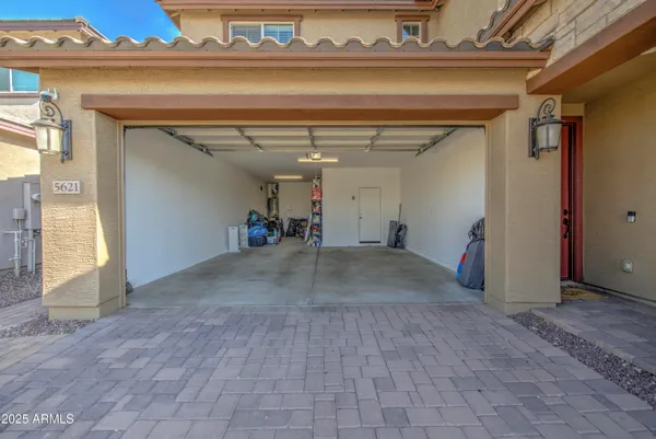 a view of a house with backyard porch and sitting area