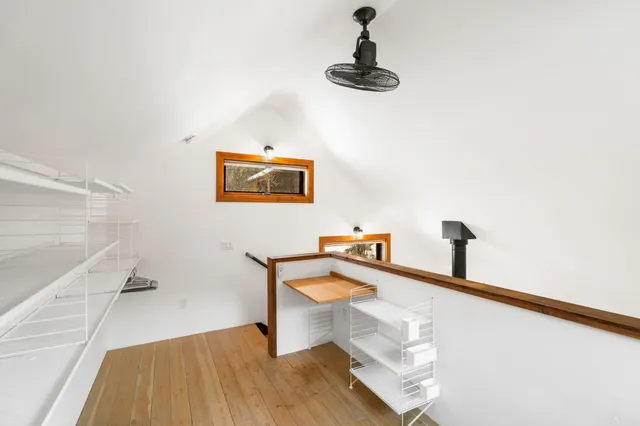 a view of staircase with furniture