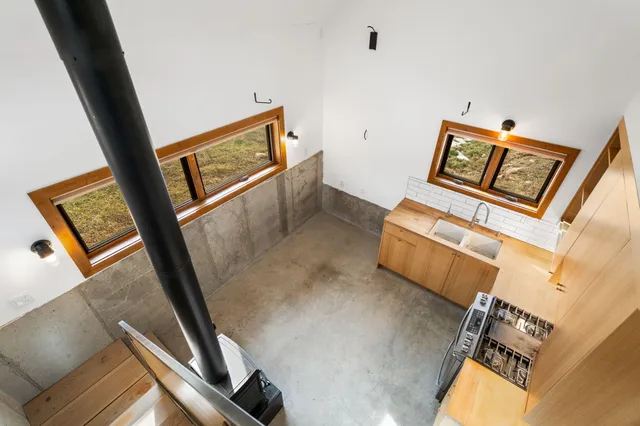 image of a room with bed and wooden floor