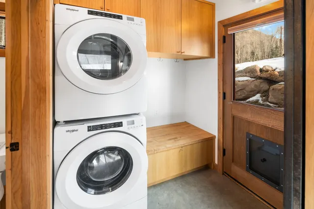a view of a house with a yard covered in snow