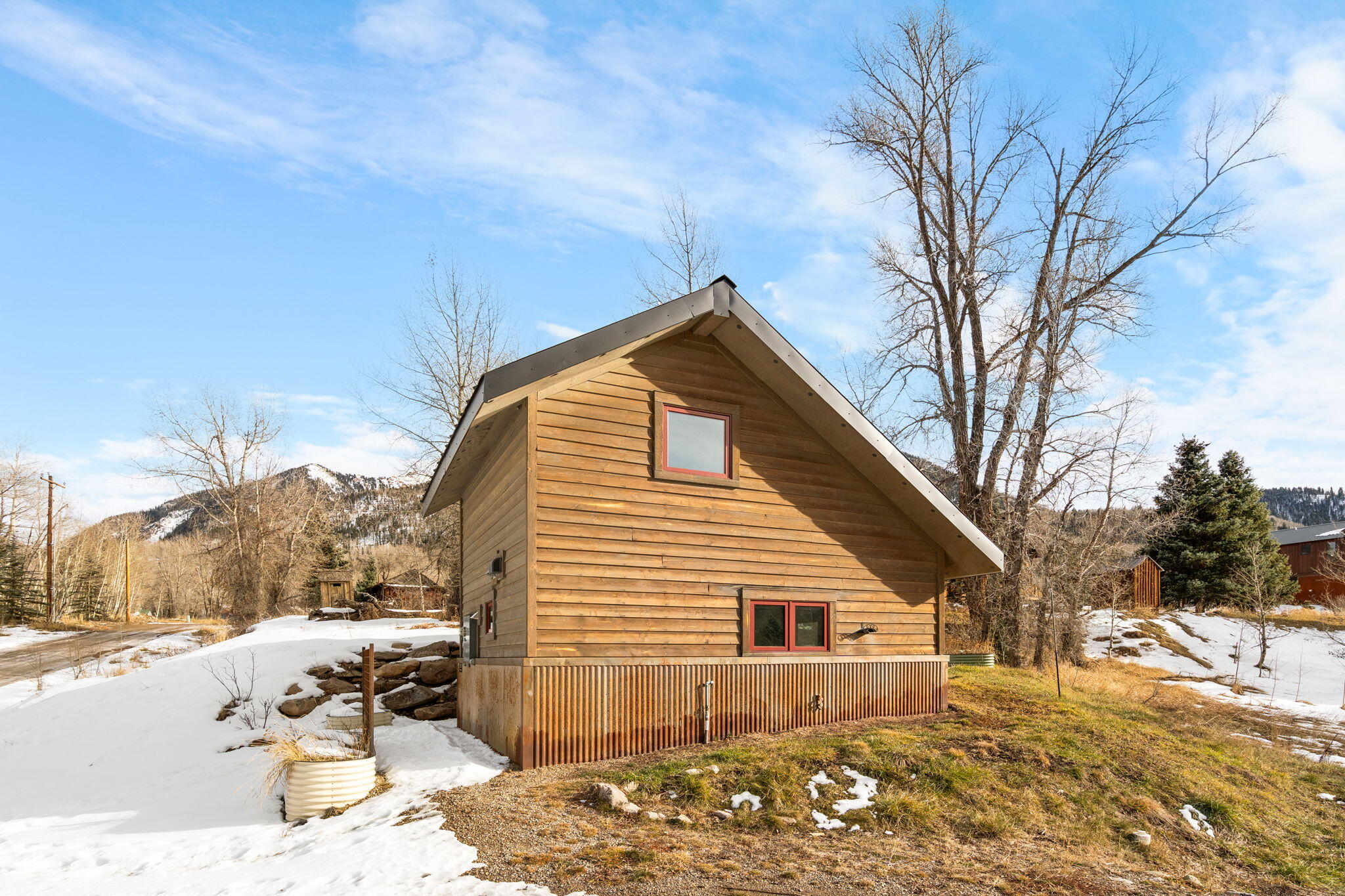 135 West Soda Street Rico, CO 81332 - Photo 19 of 47 a view of a house with a yard covered in snow