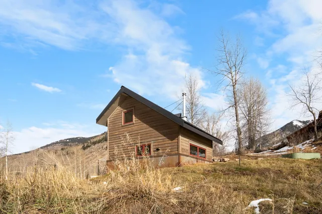 a house with trees in the background