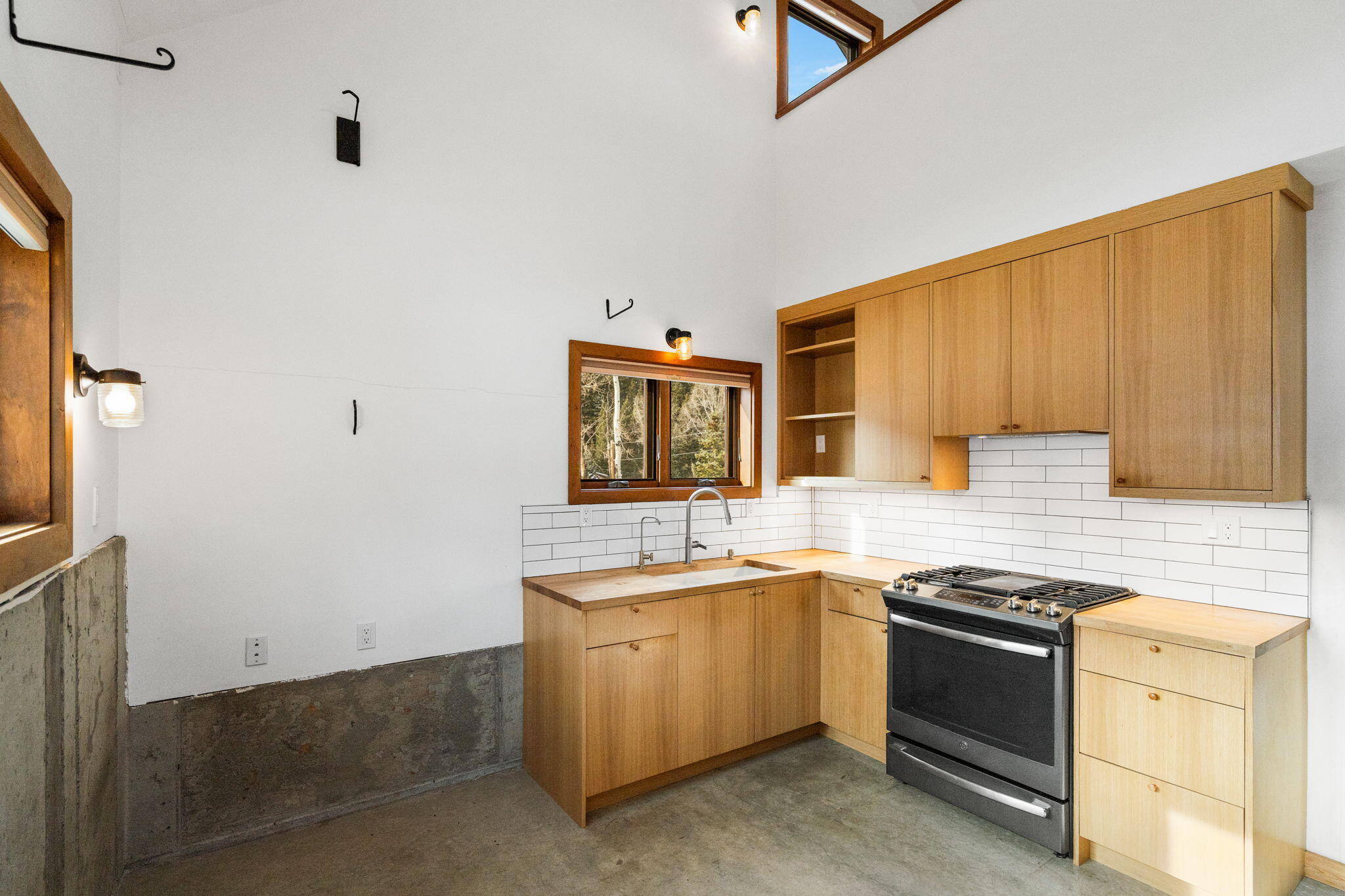 135 West Soda Street Rico, CO 81332 - Photo 3 of 47 a kitchen with stainless steel appliances granite countertop a stove and a sink
