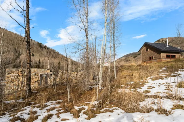 a view of snow on the roadside