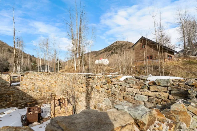 a view of the house with a yard