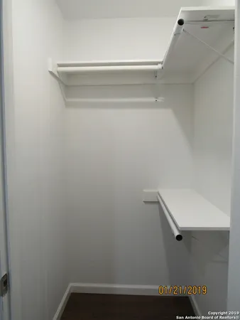 a view of a room with racks on the wall