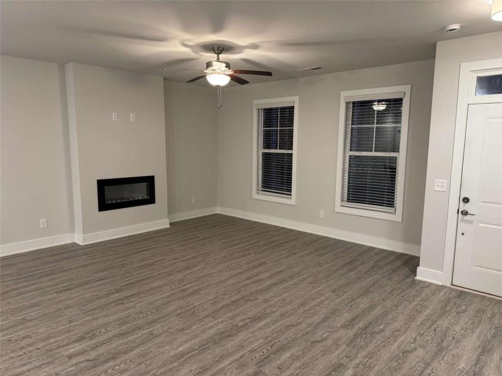 2530 Harbor Ridge Gainesville, GA 30507 - Photo 3 of 44 a view of an empty room with wooden floor and windows