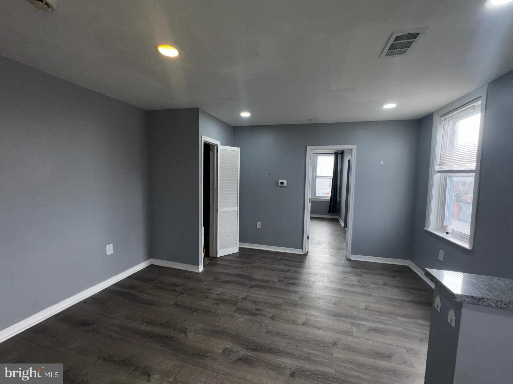 700 Lloyd Street Chester, PA 19013 - Photo 19 of 32 a view of an empty room with window and wooden floor
