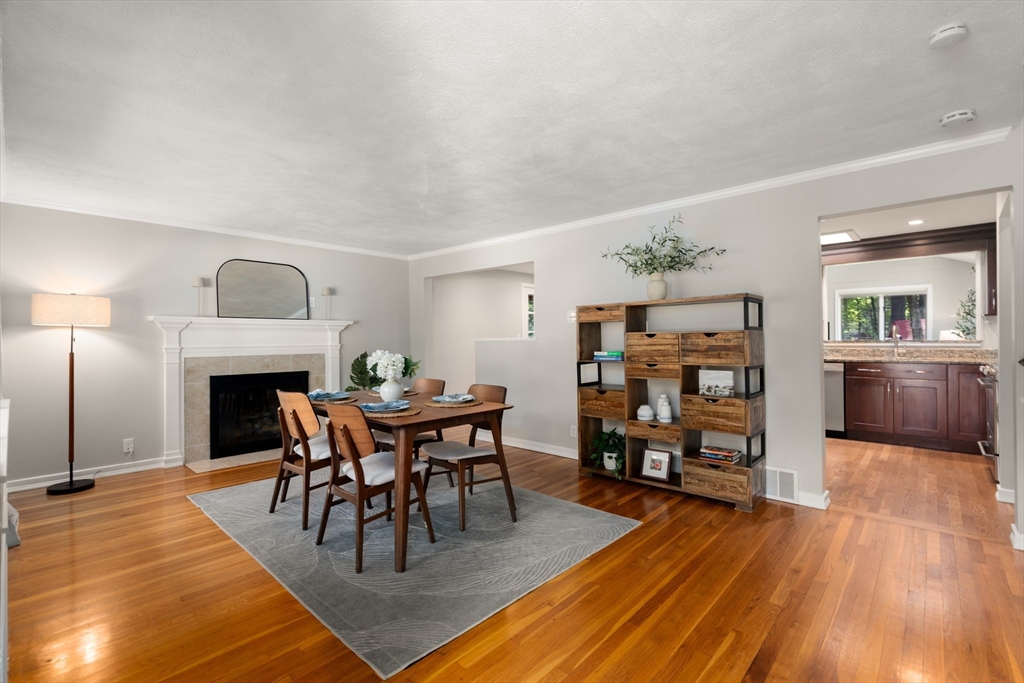 73 Willow Road Sudbury, MA 01776 - Photo 15 of 41 a dining room with furniture and wooden floor