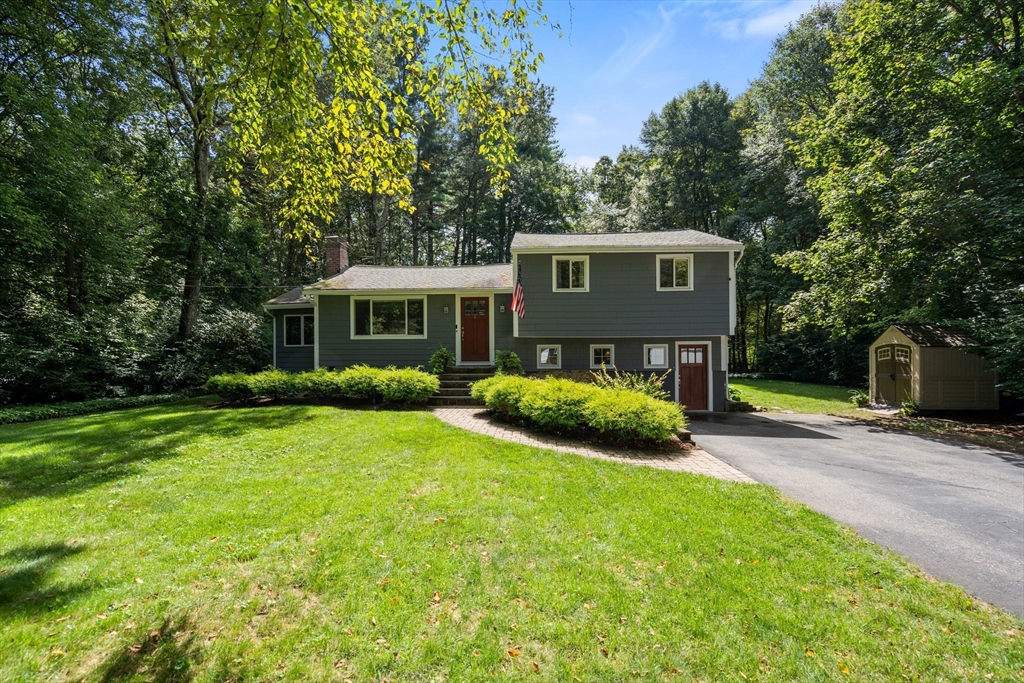 73 Willow Road Sudbury, MA 01776 - Photo 2 of 41 a view of a house with backyard and sitting area