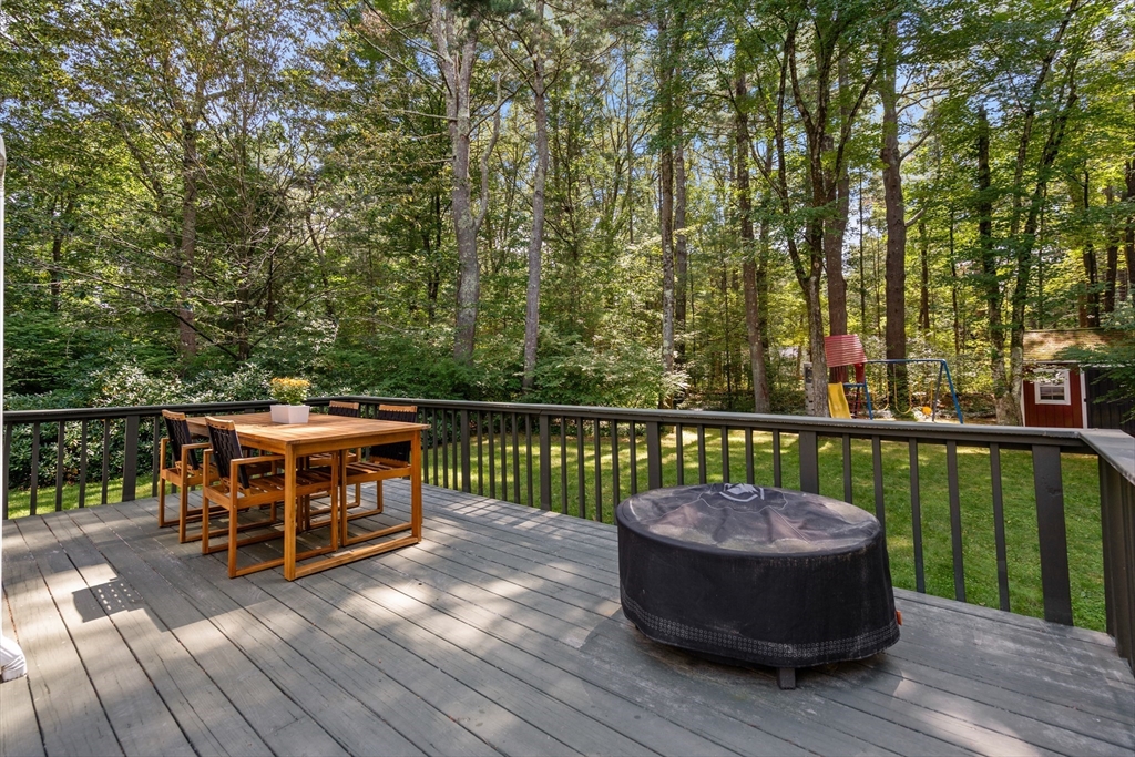 73 Willow Road Sudbury, MA 01776 - Photo 32 of 41 a view of a two chairs on the deck