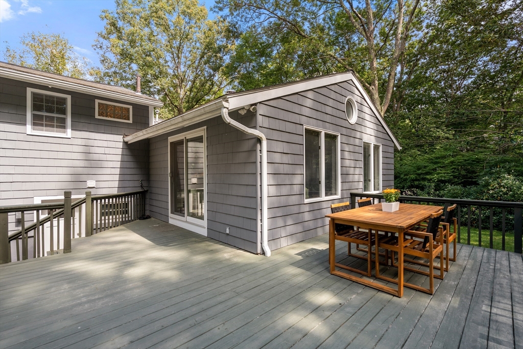 73 Willow Road Sudbury, MA 01776 - Photo 33 of 41 a backyard of a house with barbeque oven and furniture