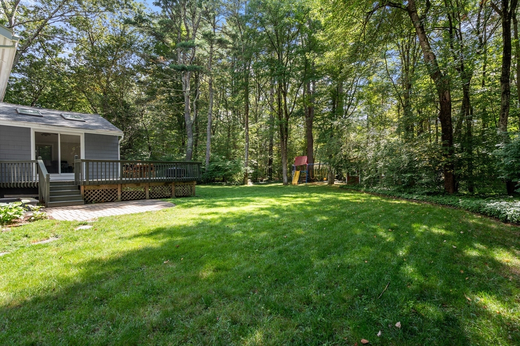 73 Willow Road Sudbury, MA 01776 - Photo 34 of 41 a backyard of a house with barbeque oven