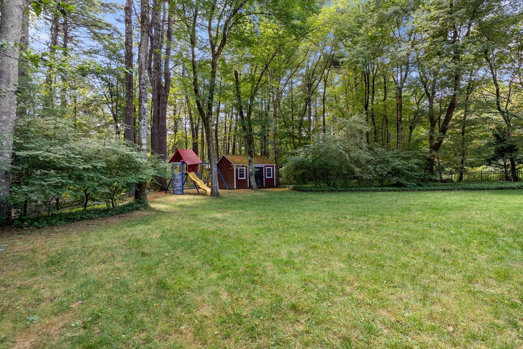 73 Willow Road Sudbury, MA 01776 - Photo 35 of 41 a view of outdoor space with playground and green space