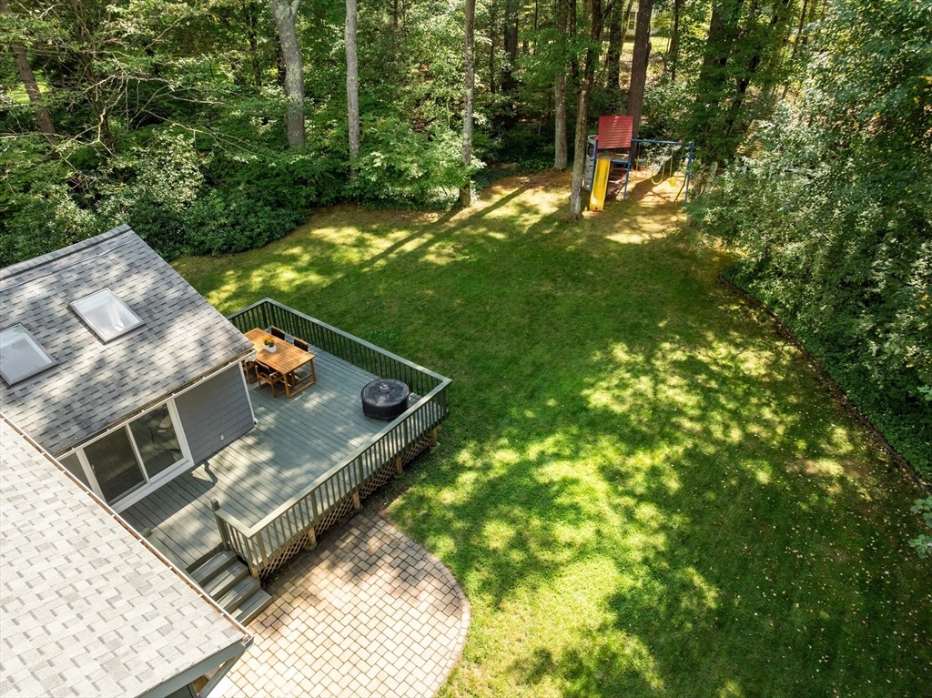 73 Willow Road Sudbury, MA 01776 - Photo 37 of 41 a view of a backyard with chairs