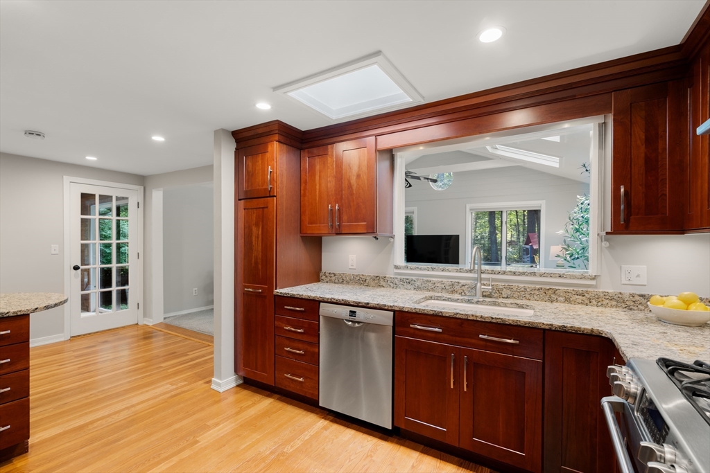73 Willow Road Sudbury, MA 01776 - Photo 9 of 41 a spacious bathroom with a granite countertop sink and a mirror