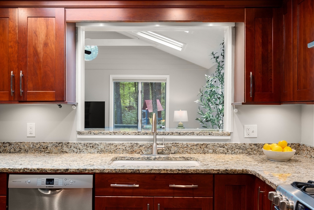 73 Willow Road Sudbury, MA 01776 - Photo 10 of 41 a kitchen with granite countertop cabinets and window
