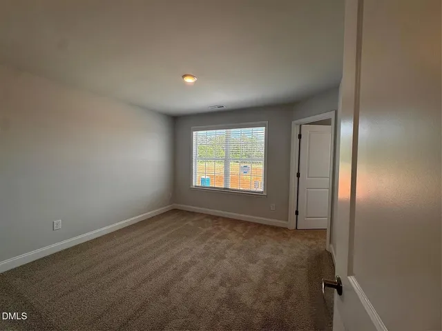a bathroom with a tub sink shower and mirror