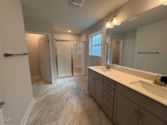 a view of a livingroom with a ceiling fan and window