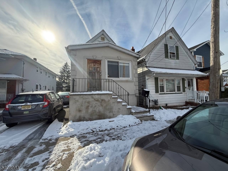 a view of a car parked in front of a house