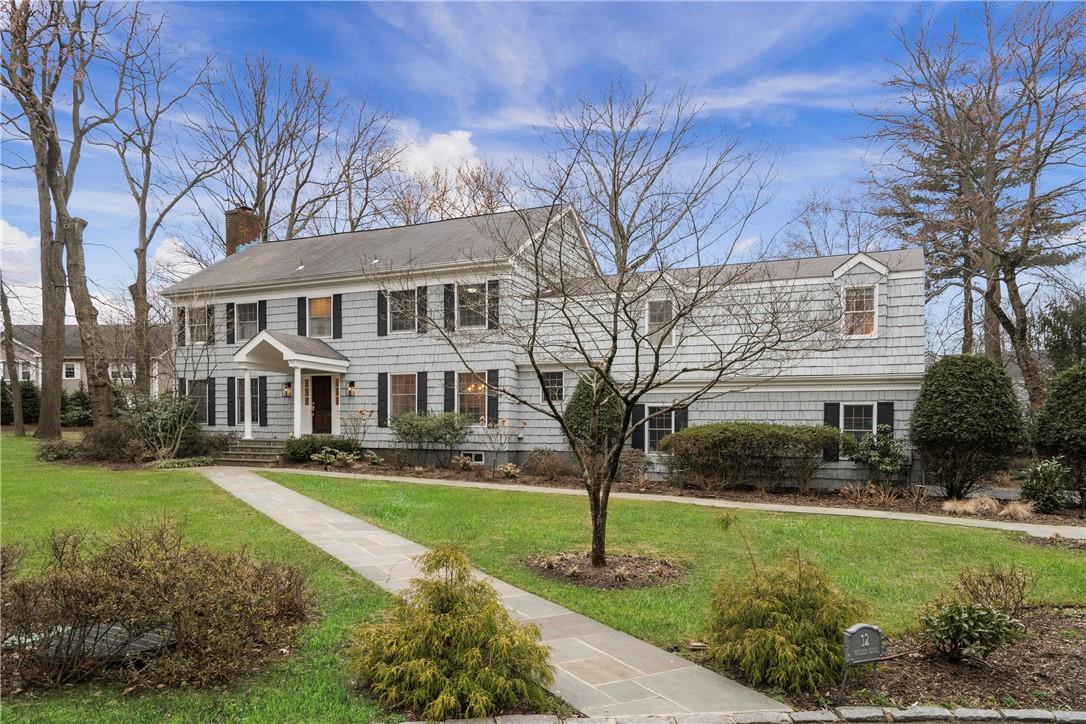 12 Walden Lane Rye, NY 10580 - Photo 1 of 1 a front view of a house with a garden and trees