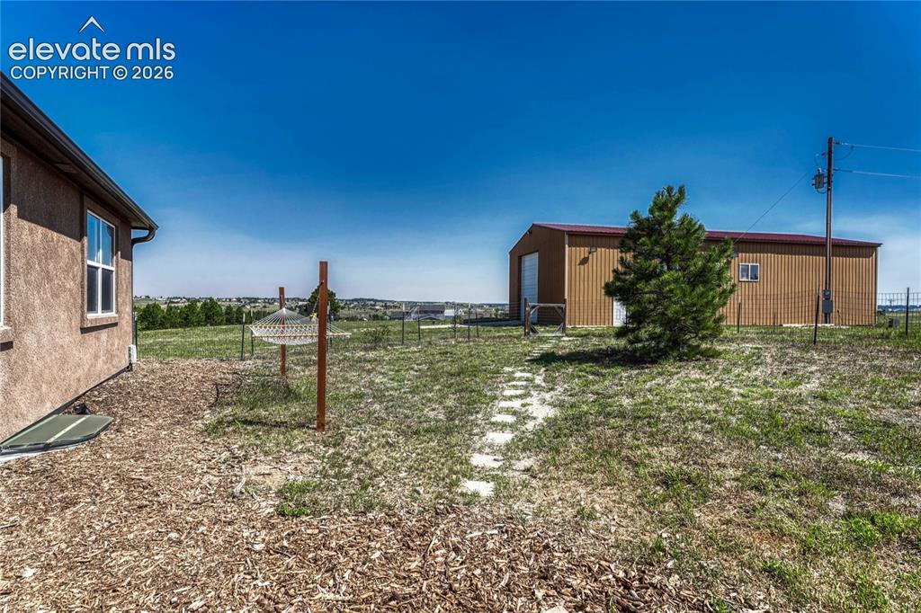 13695 Woodlake Road Elbert, CO 80106 - Photo 33 of 39 Partially fenced yard.