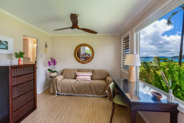 a view of a balcony with chairs