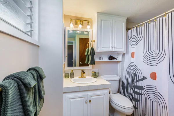 a house with palm tree in front of it