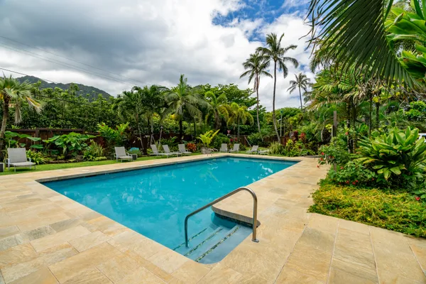 a view of swimming pool with a patio
