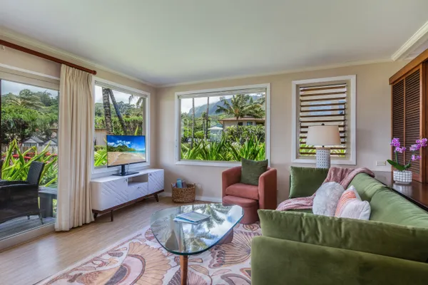 a living room with furniture and a large window