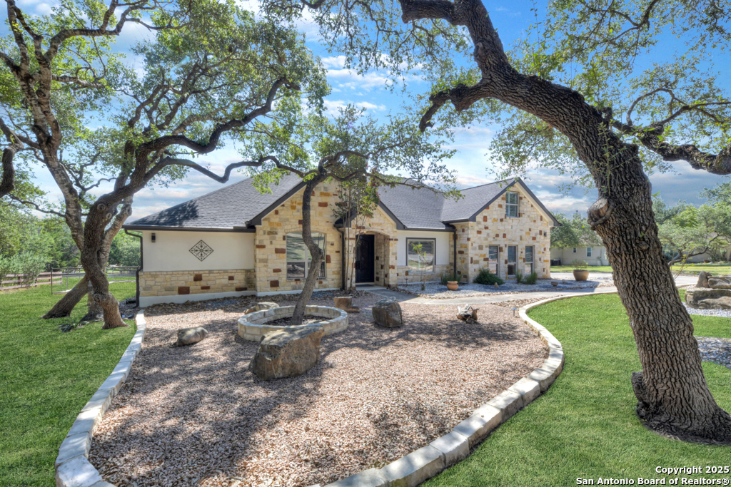 a front view of a house with garden