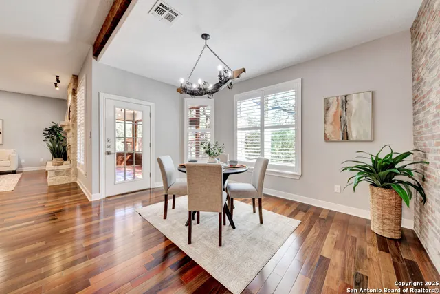 a view of a door and wooden floor